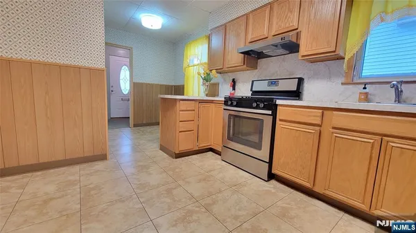 a kitchen with cabinets and appliances