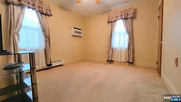 a bathroom with a sink a toilet and a shower