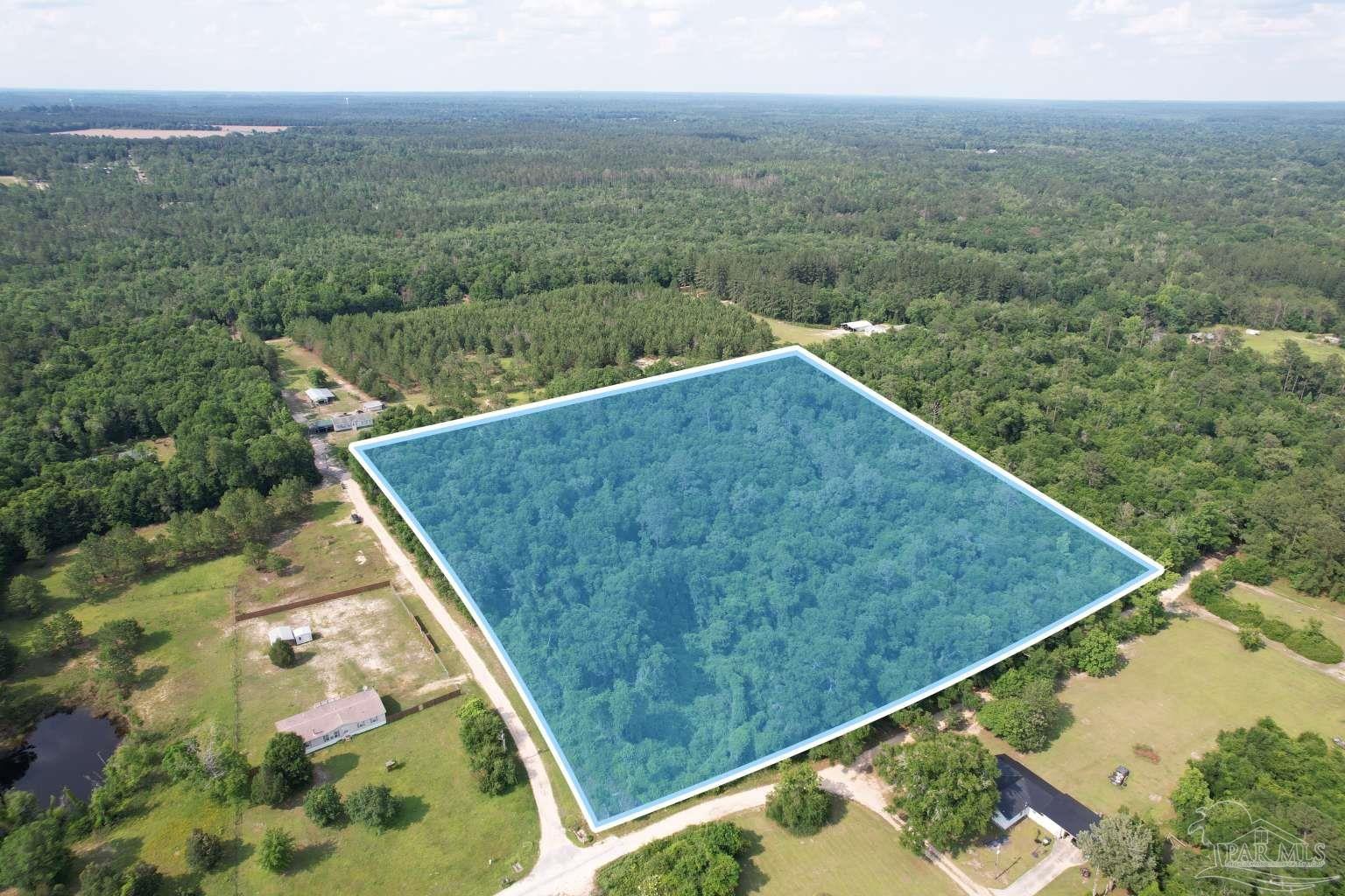 a view of a back yard from a balcony