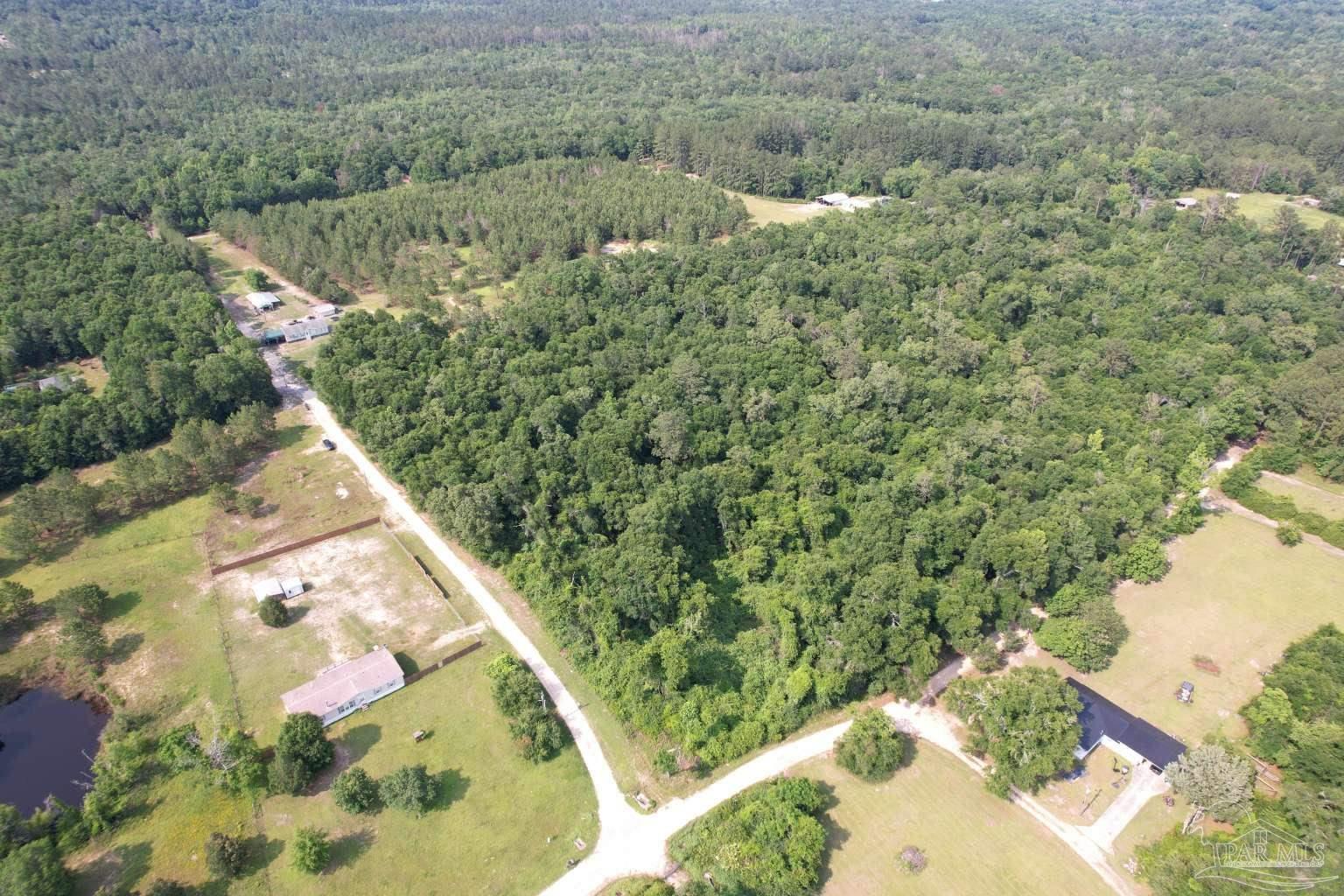 400 Brown Road McDavid, FL 32568 - Photo 9 of 10 a view of a yard with an outdoor seating