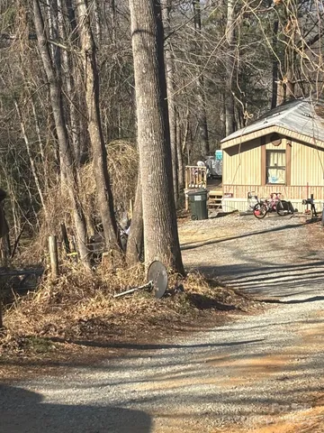 a view of a house with a yard and garage