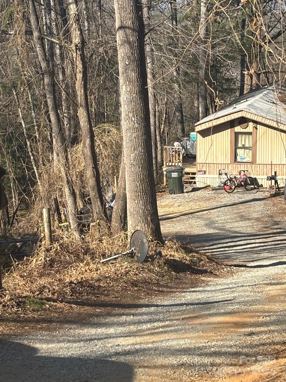 905 Hutch Mountain Road Fletcher, NC 28732 - Photo 2 of 9 a view of a house with a yard and garage