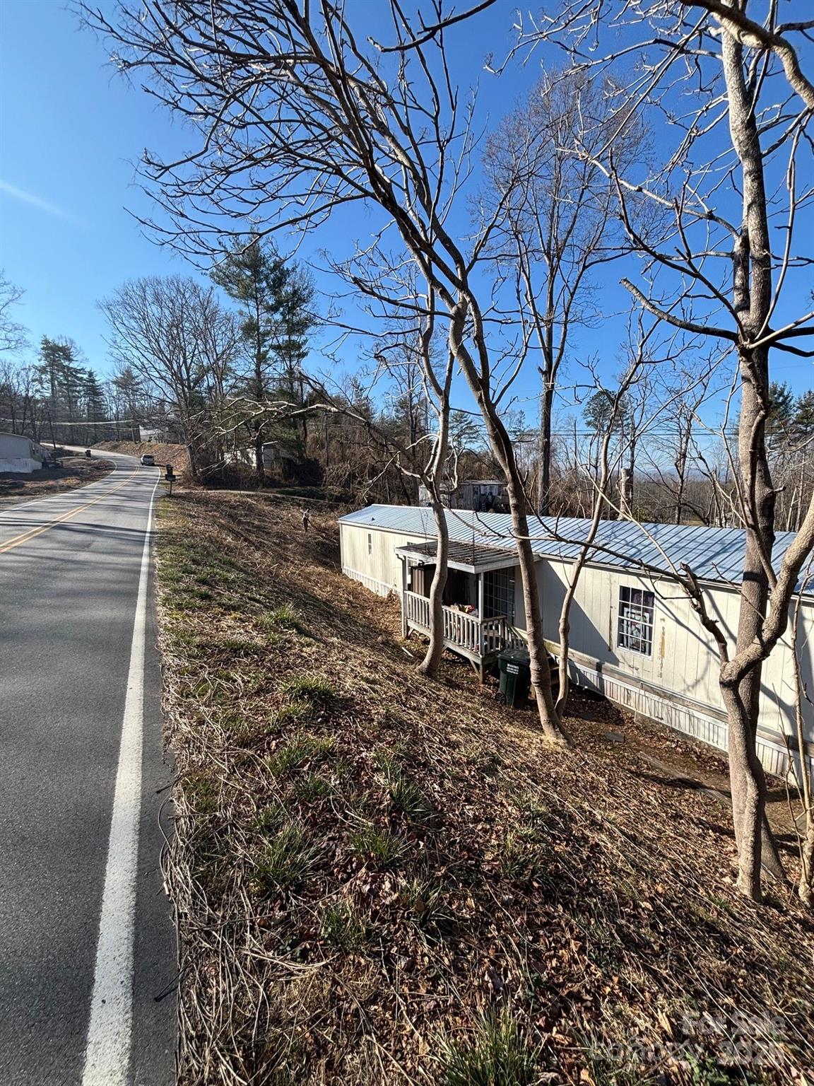 905 Hutch Mountain Road Fletcher, NC 28732 - Photo 4 of 9 a backyard of a house with table and chairs