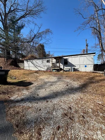 a view of a backyard of the house