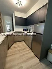 a large kitchen with stainless steel appliances granite countertop a sink and a stove
