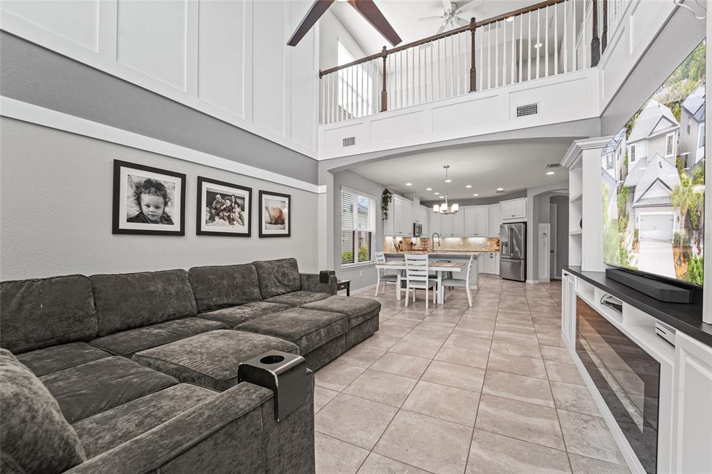 8903 Arabella Lane Seminole, FL 33777 - Photo 23 of 47 a living room with furniture and a flat screen tv