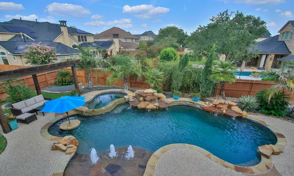 a view of a swimming pool and lounge chair