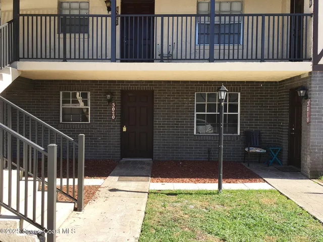 a view of a backyard with a door
