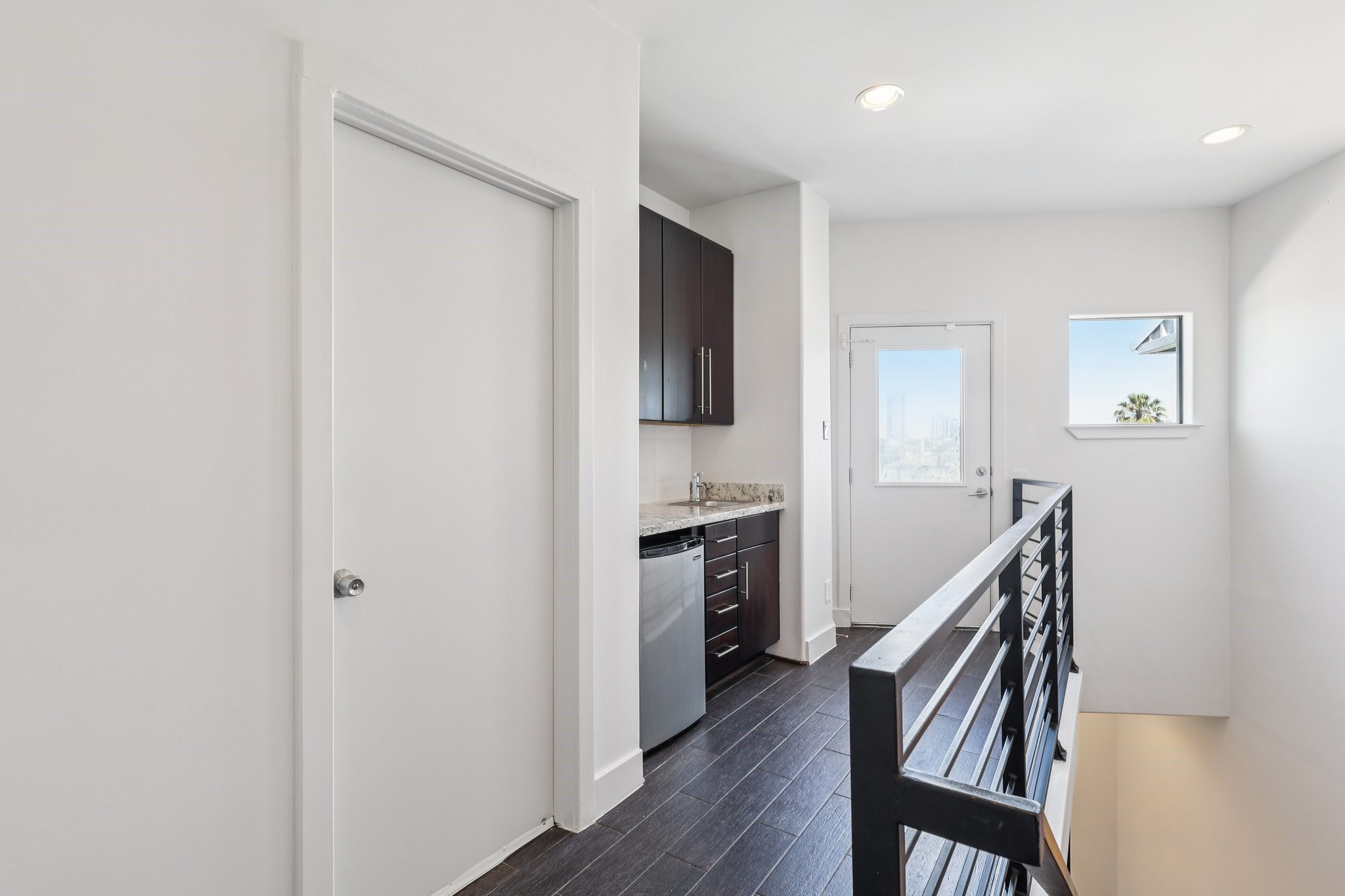1771 Michigan Street Houston, TX 77006 - Photo 25 of 28 The fourth floor offers a large attic for ample storage, then a kitchenette area for entertaining convenience.