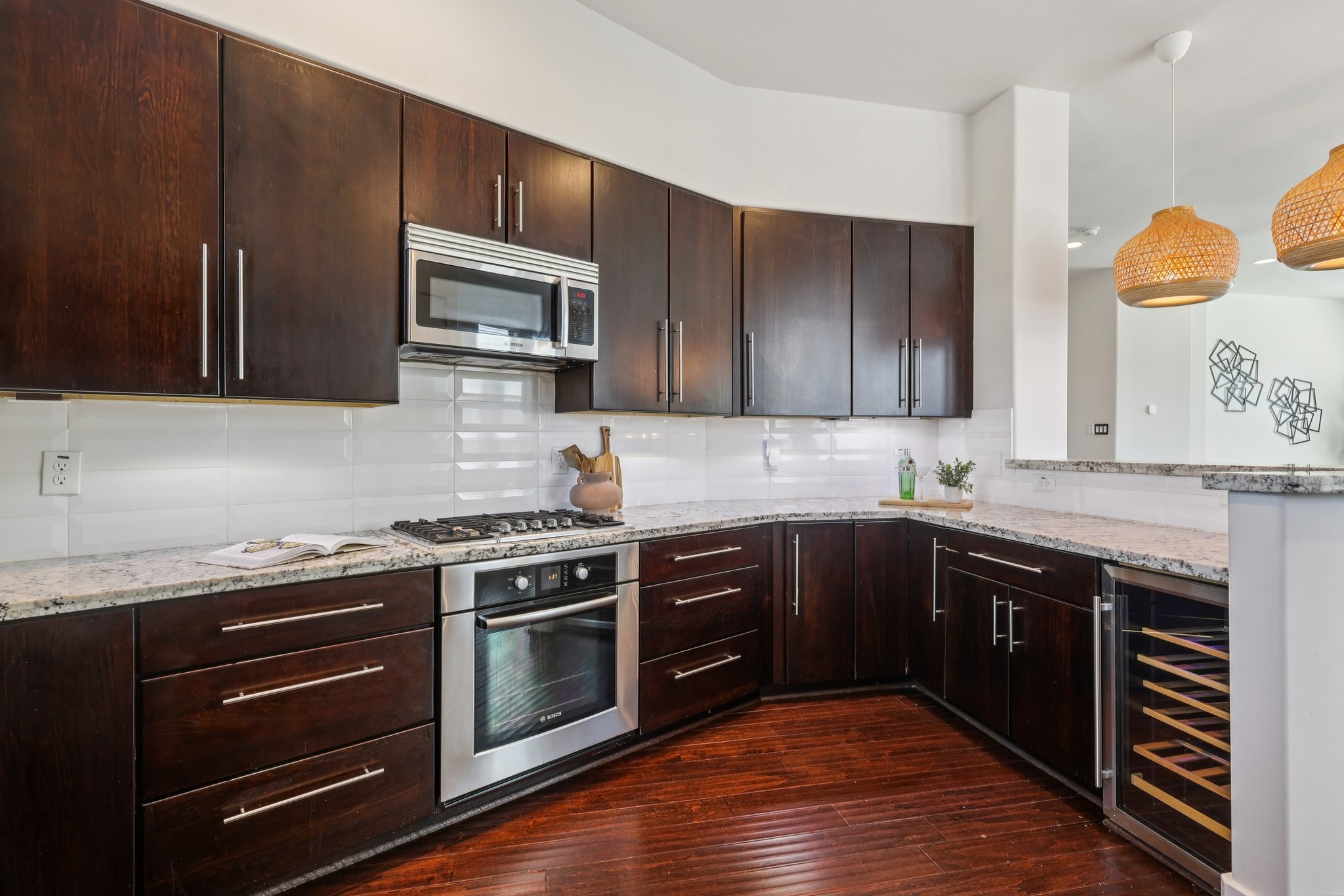 1771 Michigan Street Houston, TX 77006 - Photo 3 of 28 The kitchen offers granite counter tops, a wine cooler, and wood cabinets.