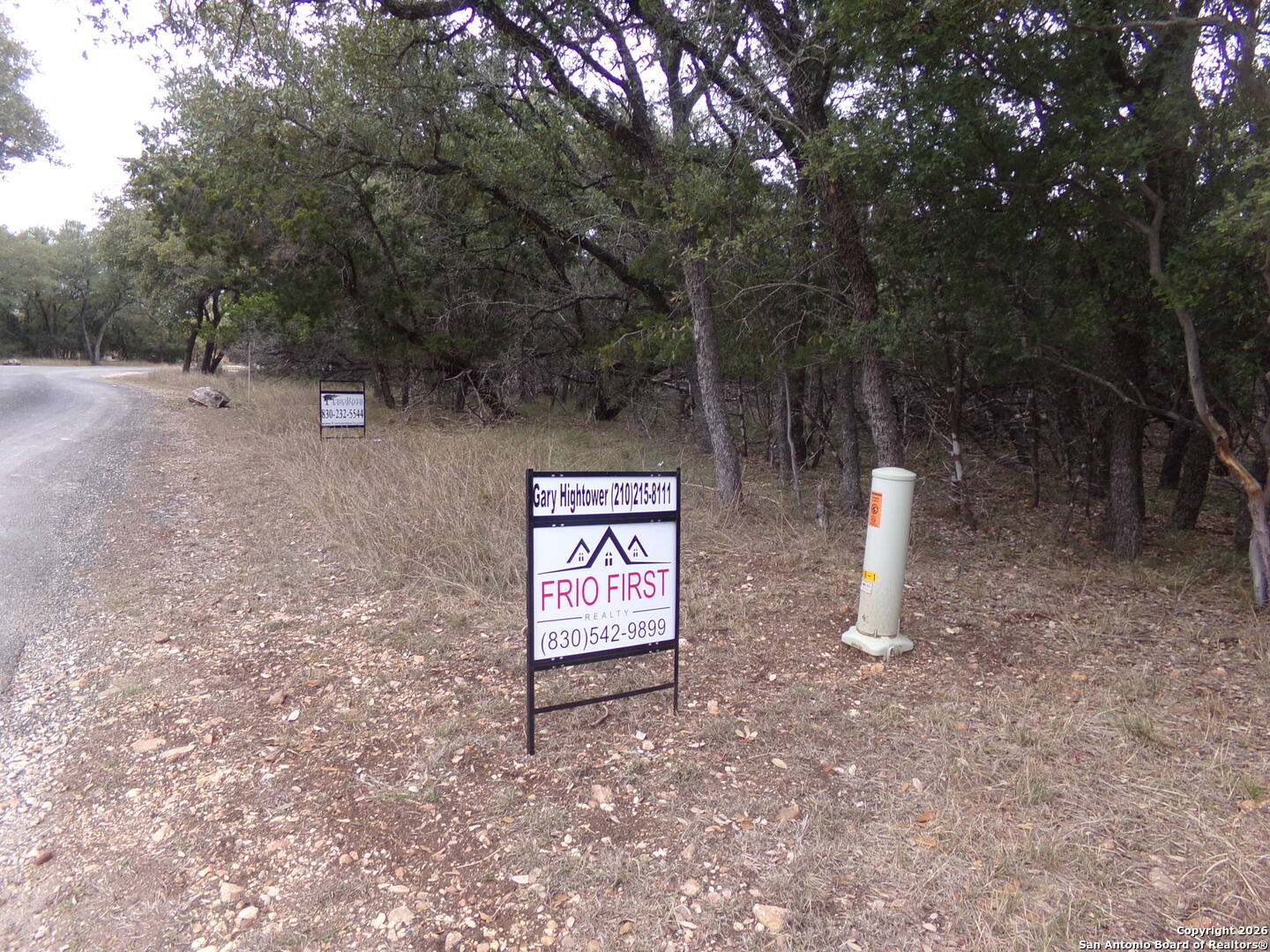 885 Mountain Valley Road Concan, TX 78838 - Photo 2 of 3 a view of an outdoor space and a yard