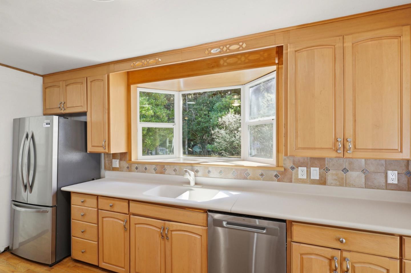 17760 China Grade Road Boulder Creek, CA 95006 - Photo 24 of 45 a kitchen with stainless steel appliances granite countertop a refrigerator and a sink