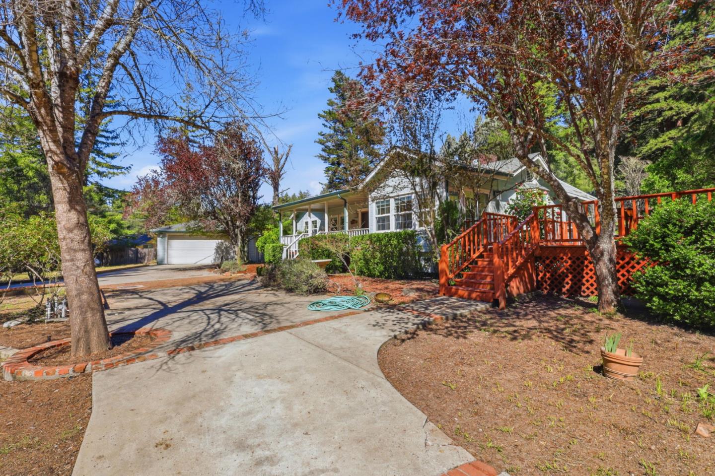 17760 China Grade Road Boulder Creek, CA 95006 - Photo 3 of 45 a view of a house with large trees and a barn