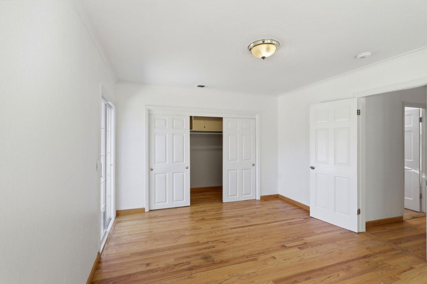 17760 China Grade Road Boulder Creek, CA 95006 - Photo 32 of 45 a view of an empty room with wooden floor and closet