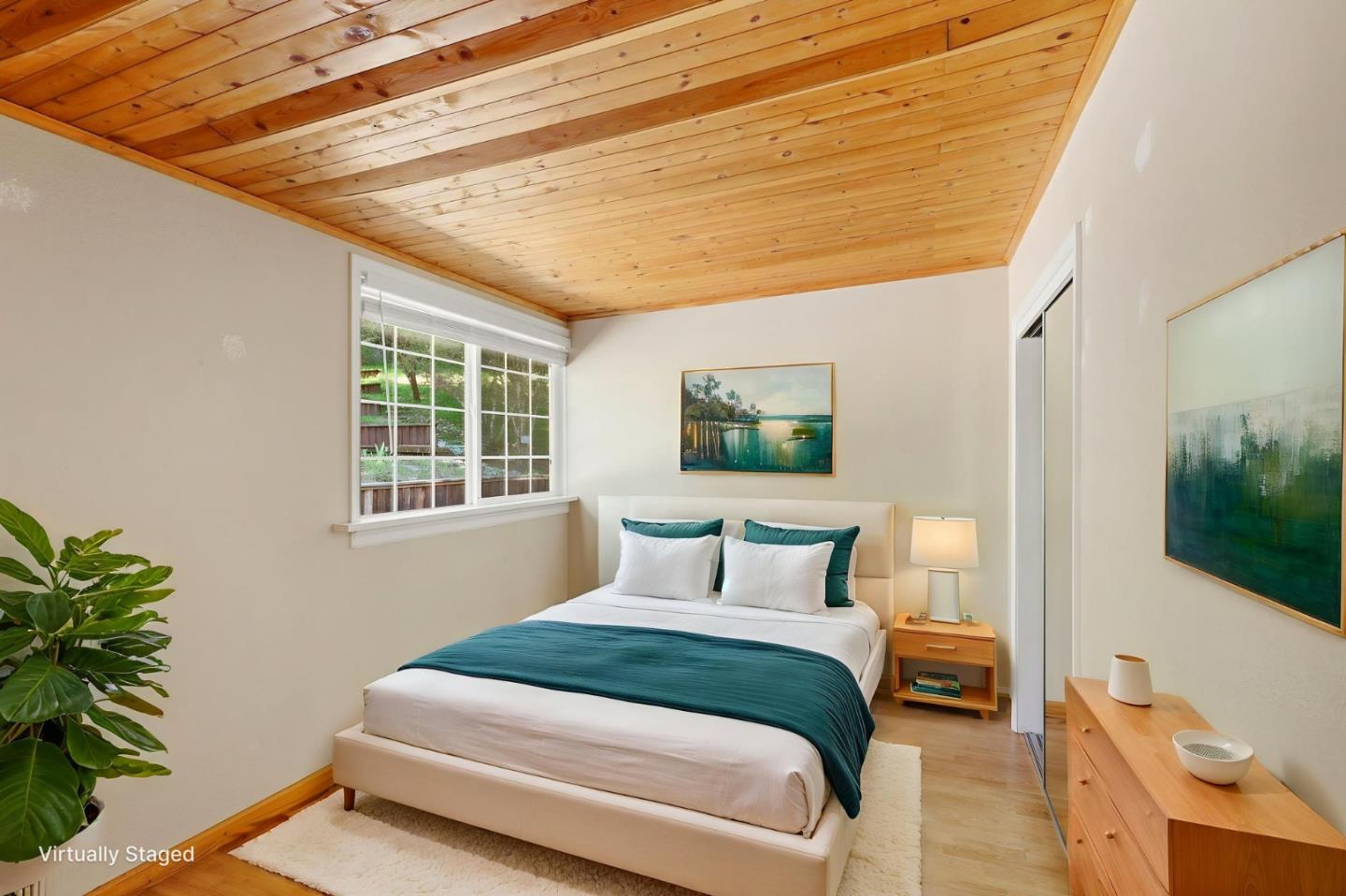 17760 China Grade Road Boulder Creek, CA 95006 - Photo 36 of 45 a bedroom with a bed and a potted plant