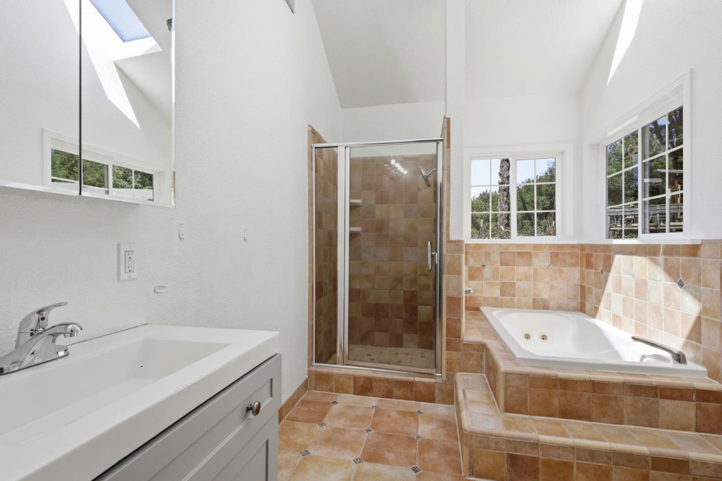17760 China Grade Road Boulder Creek, CA 95006 - Photo 41 of 45 a bathroom with a sink a bathtub and a shower