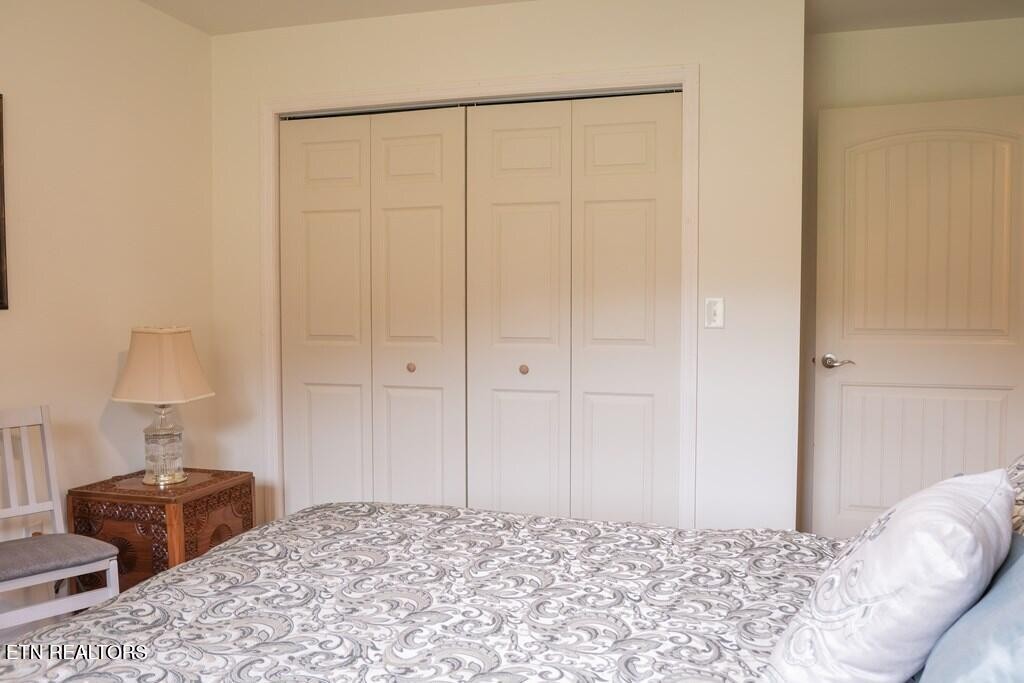 1518 Cummingsville And Sparkman Road Doyle, TN 38559 - Photo 19 of 58 a bedroom with a bed and a closet