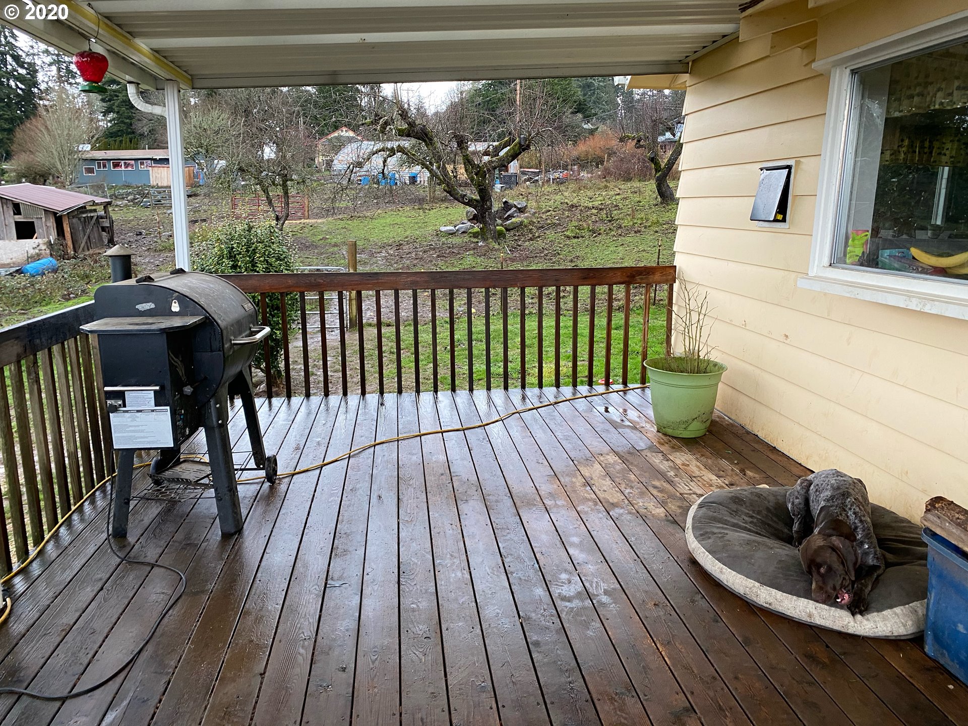 18711 Beaver Falls Road Clatskanie, OR 97016 - Photo 11 of 14 a view of a balcony with chairs and wooden floor
