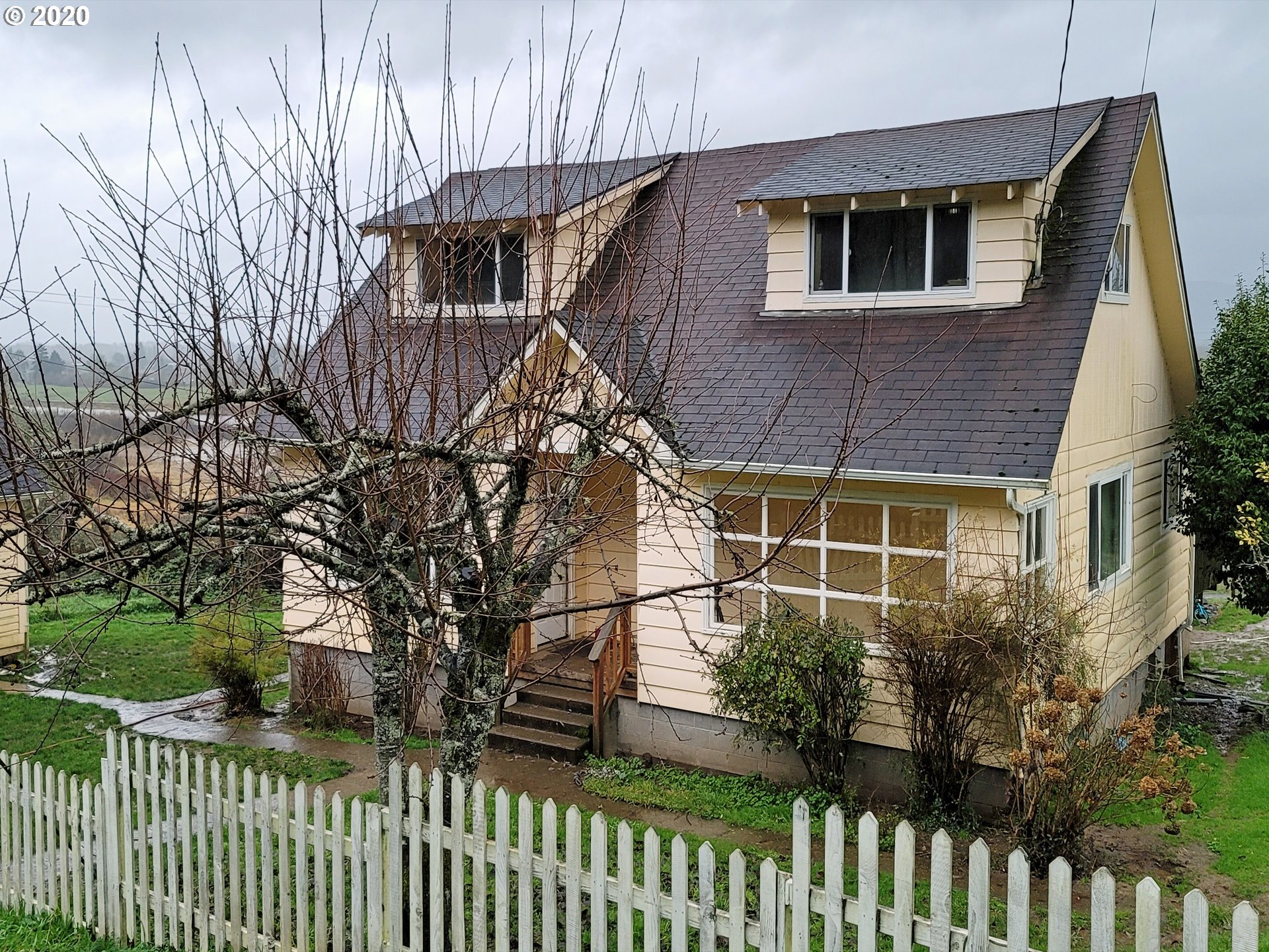 18711 Beaver Falls Road Clatskanie, OR 97016 - Photo 2 of 14 a house view with a garden