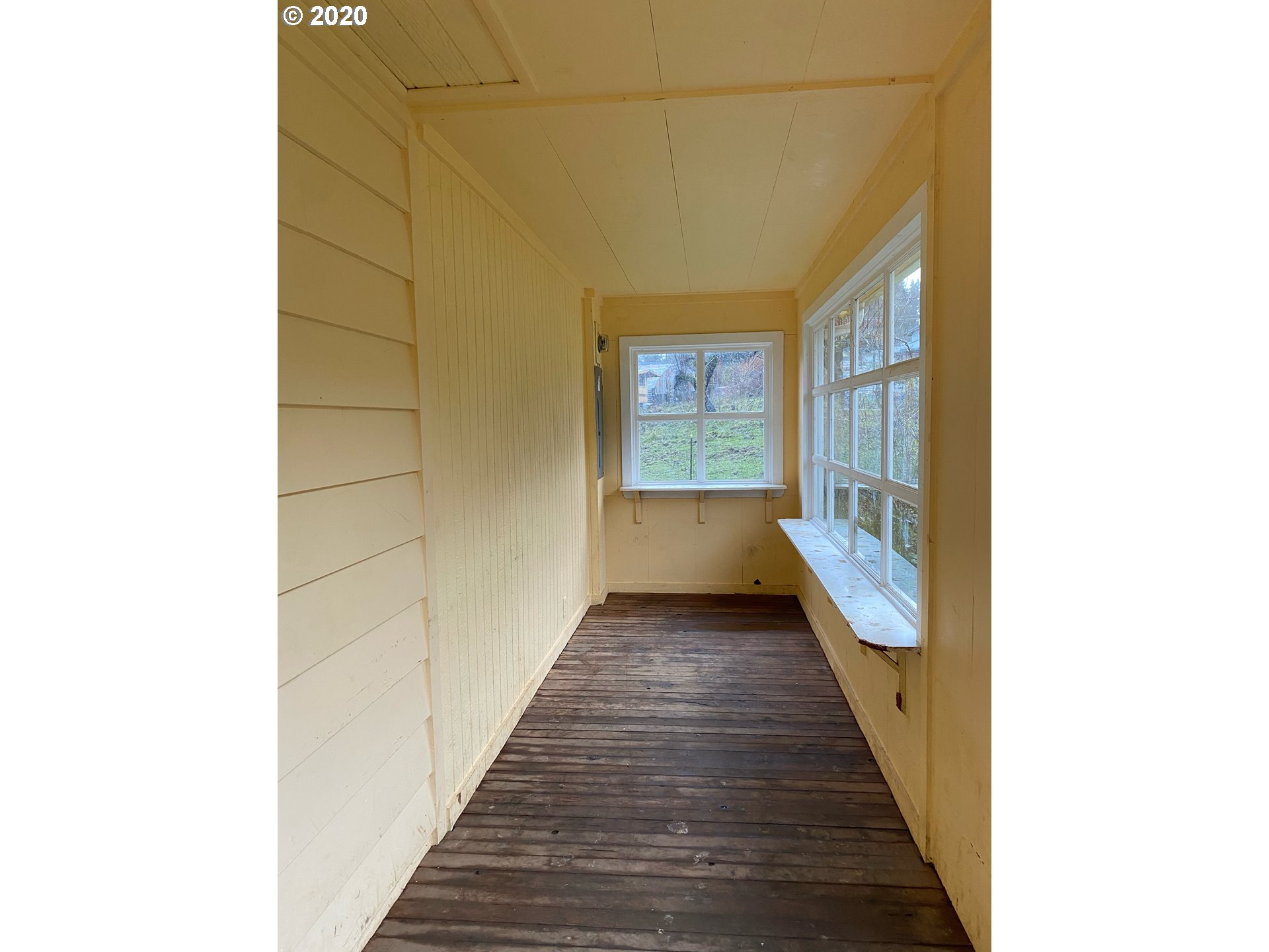 18711 Beaver Falls Road Clatskanie, OR 97016 - Photo 3 of 14 a view of a hallway with wooden floor