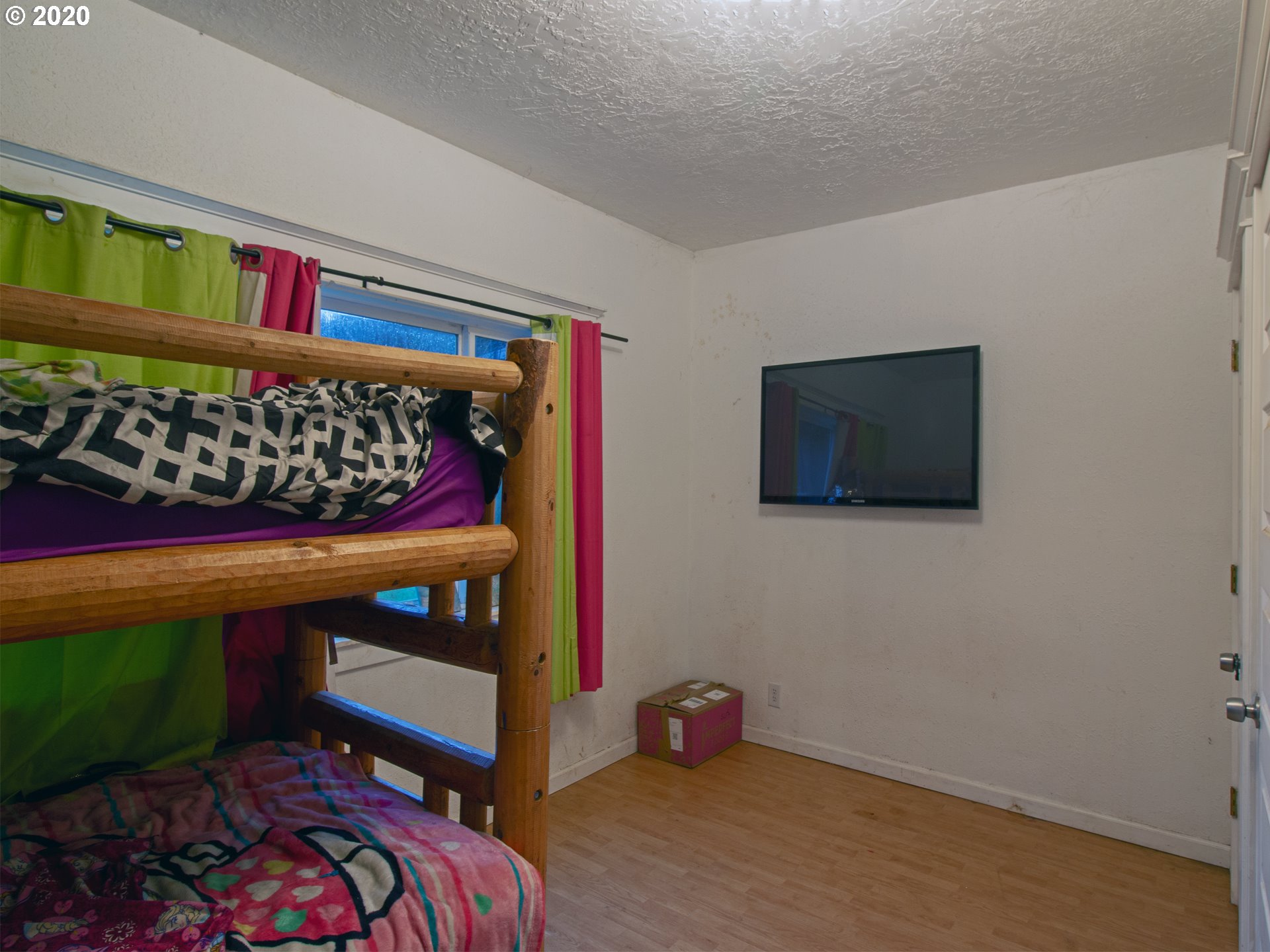 18711 Beaver Falls Road Clatskanie, OR 97016 - Photo 10 of 14 a bed room with a bed and a couch