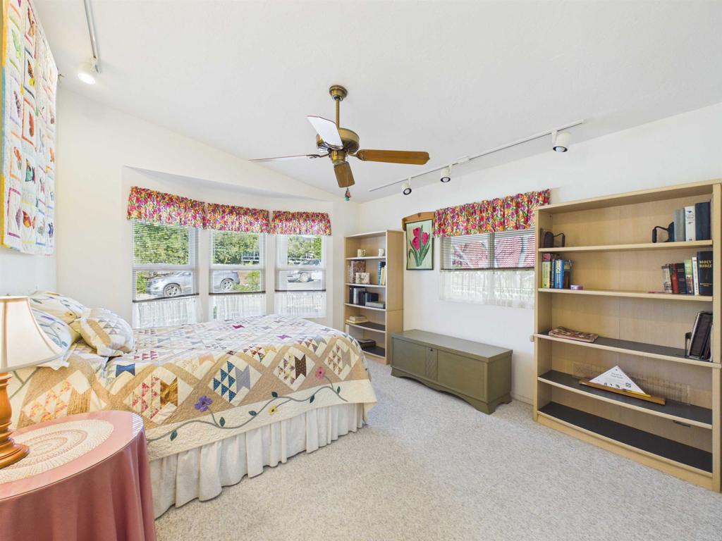 18218 Paradise Mountain Road, Unit 220 Valley Center, CA 92082 - Photo 35 of 48 a bedroom with furniture and a window