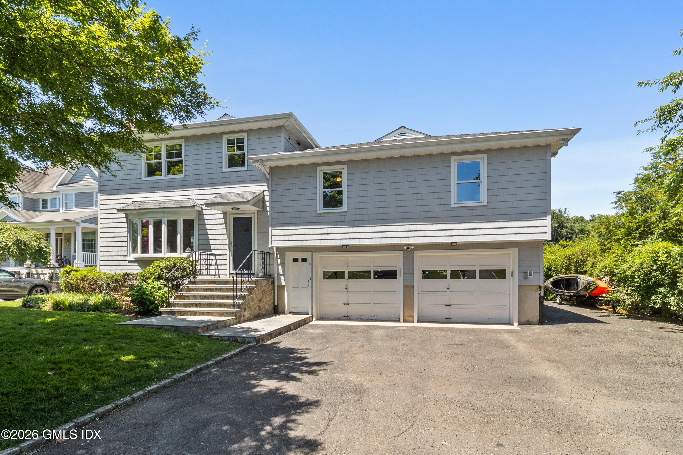 9 Deluca Drive Cos Cob, CT 06807 - Photo 29 of 30 front view of a house with a yard