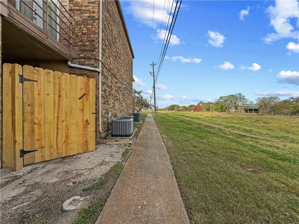 a house view with a tree in front of it