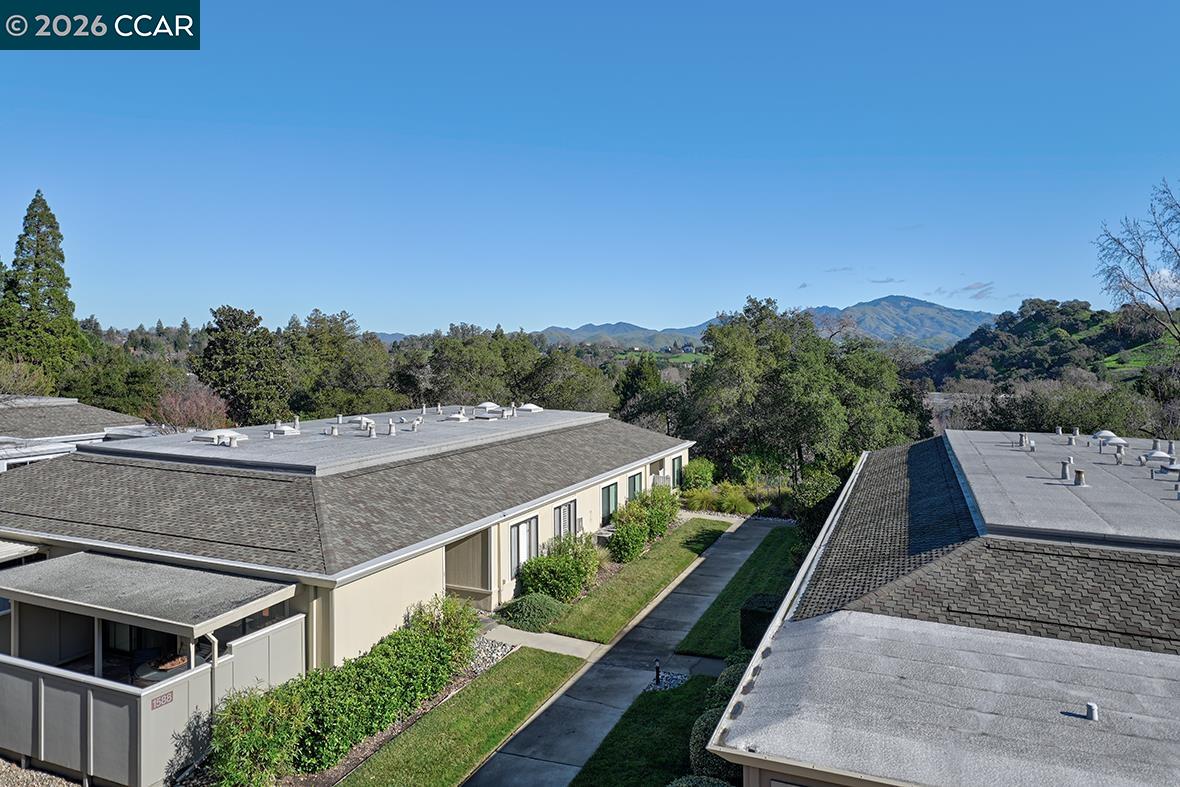 1548 Golden Rain Road, Unit 9 Walnut Creek, CA 94595 - Photo 14 of 45 a aerial view of a house with a yard