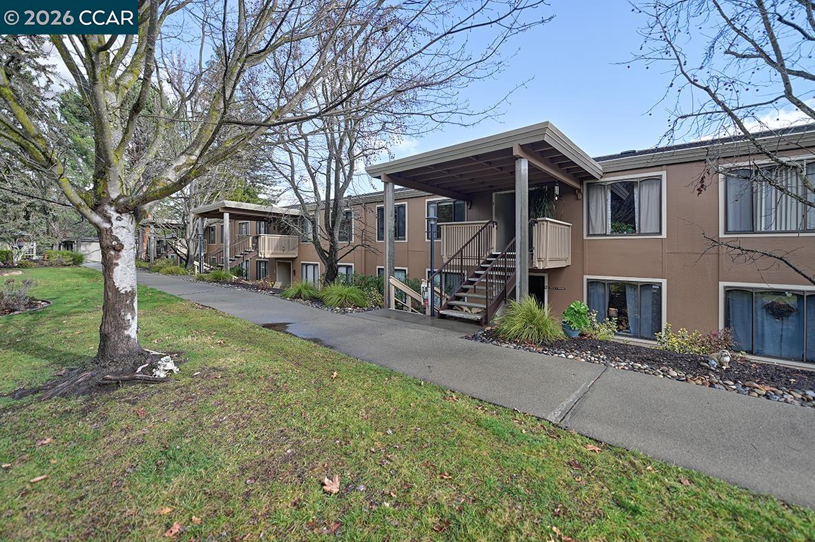 1548 Golden Rain Road, Unit 9 Walnut Creek, CA 94595 - Photo 2 of 45 a front view of a house with garden
