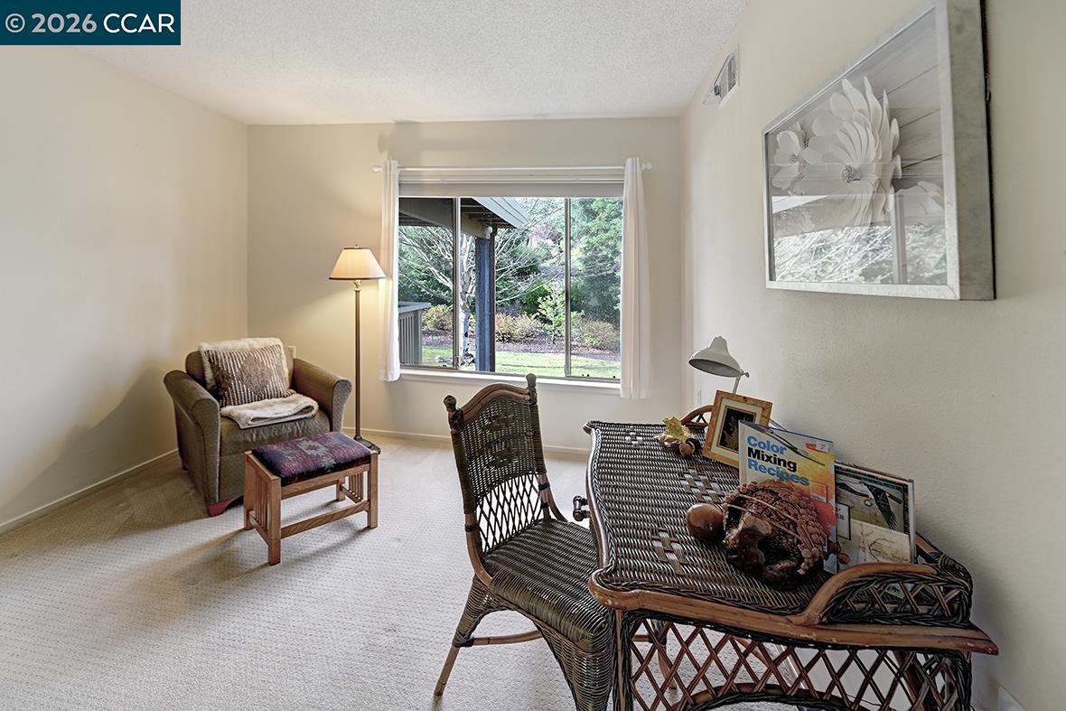1548 Golden Rain Road, Unit 9 Walnut Creek, CA 94595 - Photo 22 of 45 a living room with furniture and a window