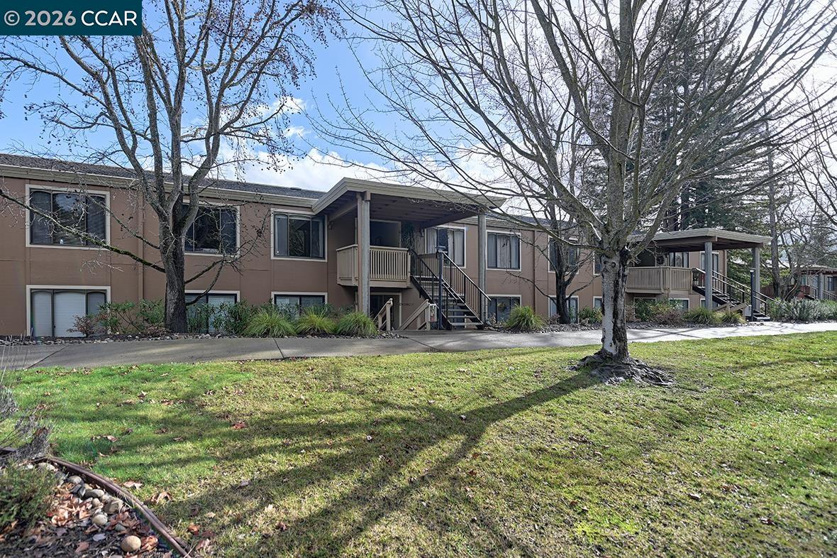 1548 Golden Rain Road, Unit 9 Walnut Creek, CA 94595 - Photo 32 of 45 a house that has a tree in front of it