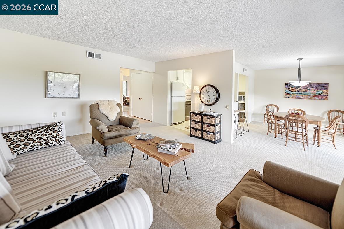 1548 Golden Rain Road, Unit 9 Walnut Creek, CA 94595 - Photo 7 of 45 a living room with furniture