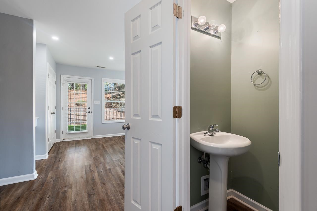 308 Saranac Ridge Drive Holly Springs, NC 27540 - Photo 21 of 41 a bathroom with a sink a toilet and shower