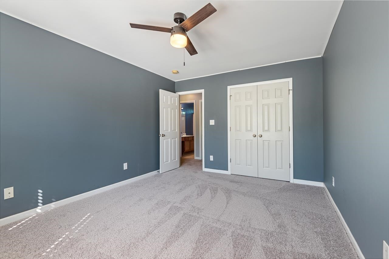 308 Saranac Ridge Drive Holly Springs, NC 27540 - Photo 31 of 41 a view of an empty room and a ceiling fan
