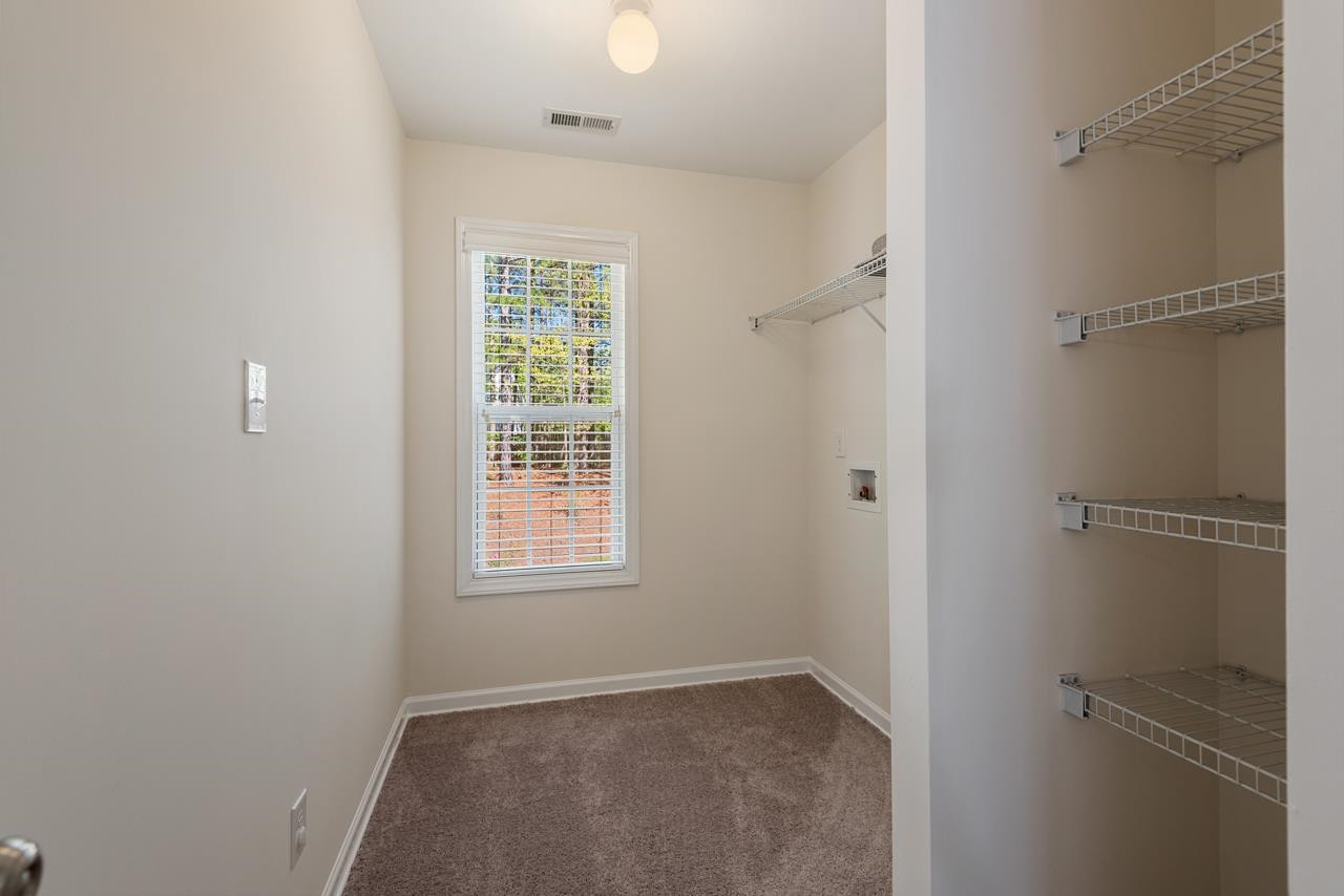 308 Saranac Ridge Drive Holly Springs, NC 27540 - Photo 33 of 41 a view of an empty room with a window