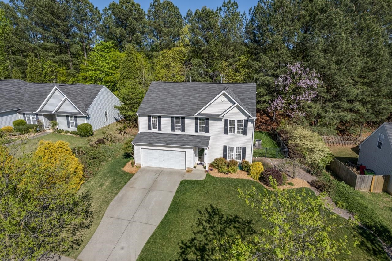308 Saranac Ridge Drive Holly Springs, NC 27540 - Photo 39 of 41 a aerial view of a house with a yard and large trees