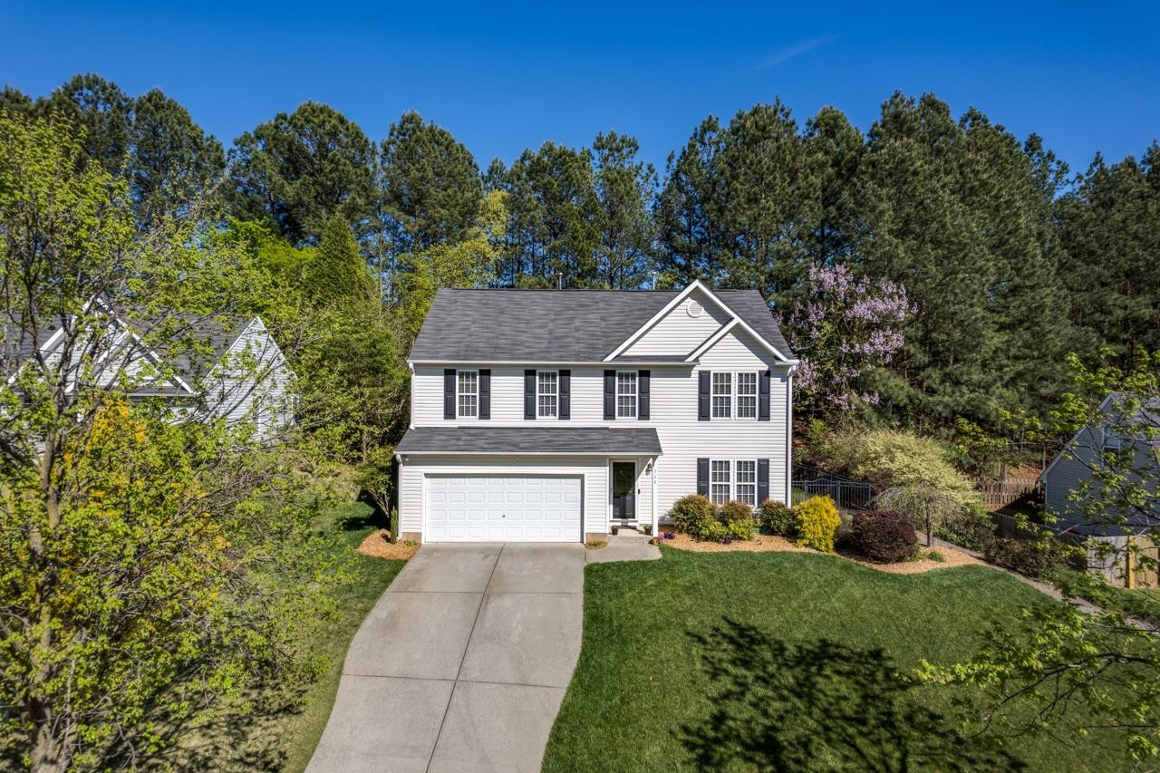 308 Saranac Ridge Drive Holly Springs, NC 27540 - Photo 40 of 41 a house that has a tree in it