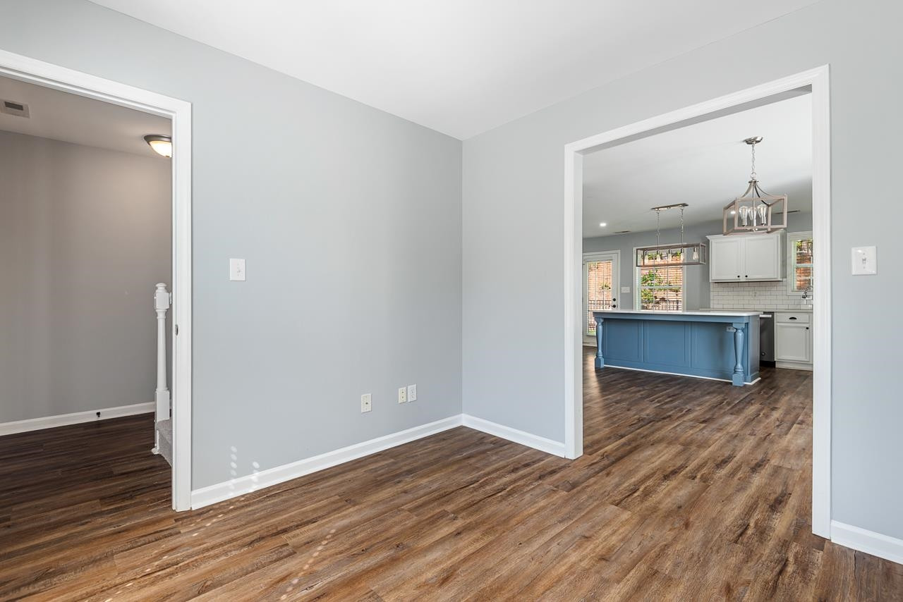 308 Saranac Ridge Drive Holly Springs, NC 27540 - Photo 8 of 41 wooden floor in an empty room with a window