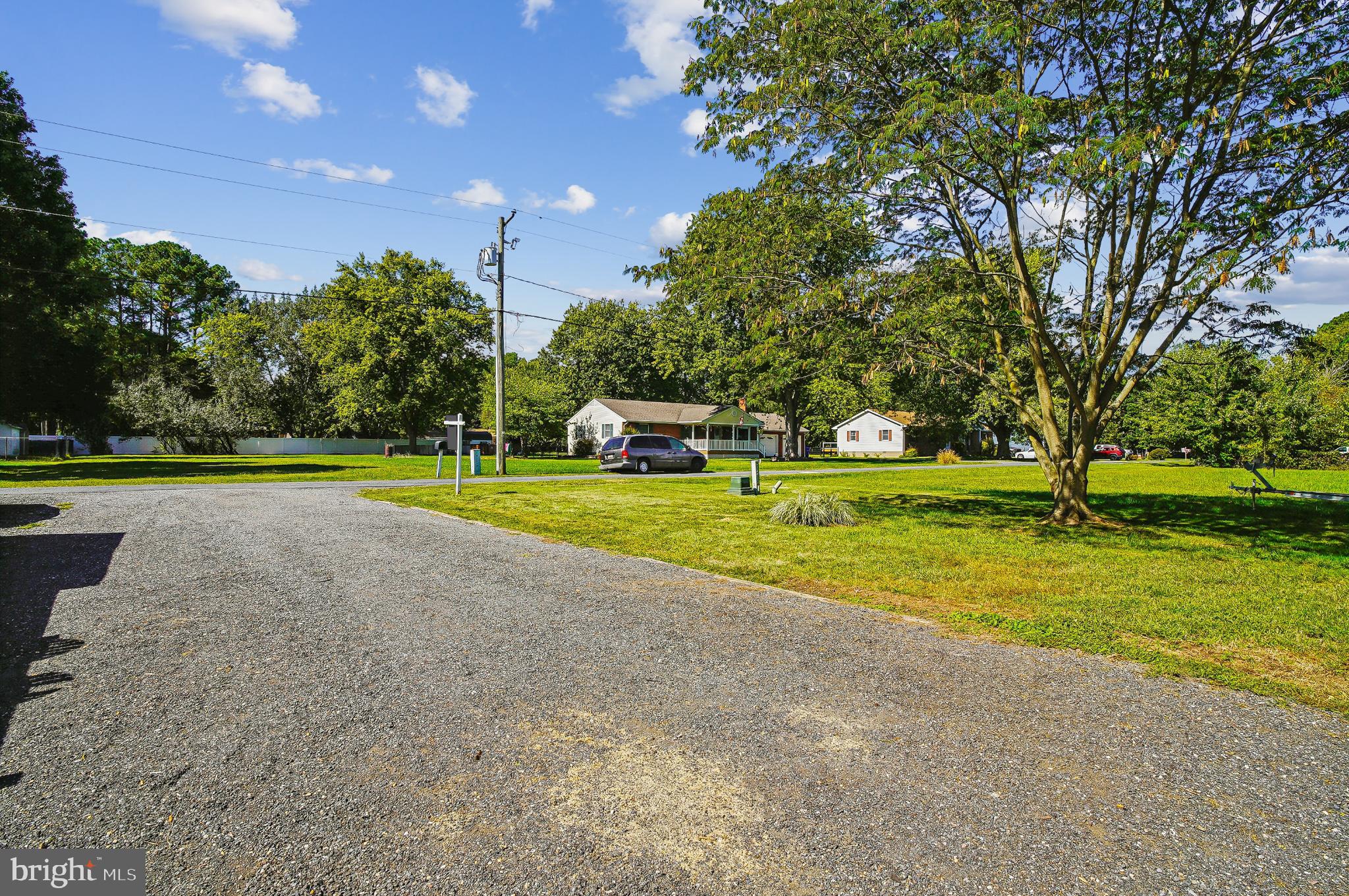 123 Long Point Road Stevensville, MD 21666 - Photo 36 of 47 Spacious yard with charming home backdrop.