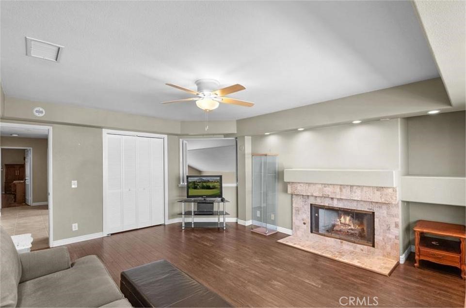 42050 Humber Drive Temecula, CA 92591 - Photo 20 of 31 a living room with furniture and a fireplace