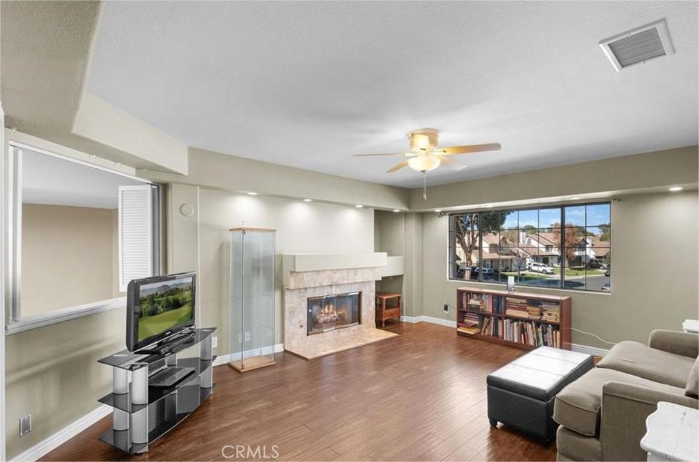 42050 Humber Drive Temecula, CA 92591 - Photo 21 of 31 a living room with furniture a fireplace and a flat screen tv