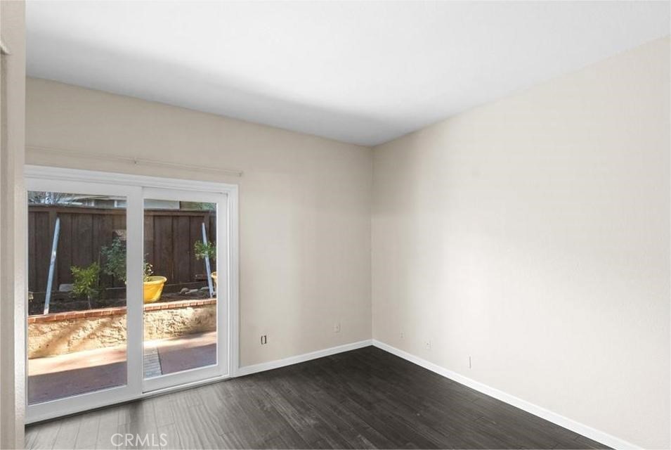 42050 Humber Drive Temecula, CA 92591 - Photo 26 of 31 an empty room with wooden floor and a window