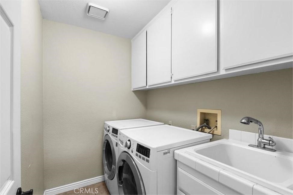 42050 Humber Drive Temecula, CA 92591 - Photo 30 of 31 a utility room with dryer and washer