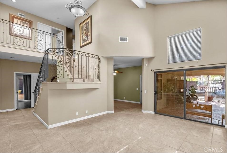 42050 Humber Drive Temecula, CA 92591 - Photo 5 of 31 a view of a hallway with a large window and chandelier