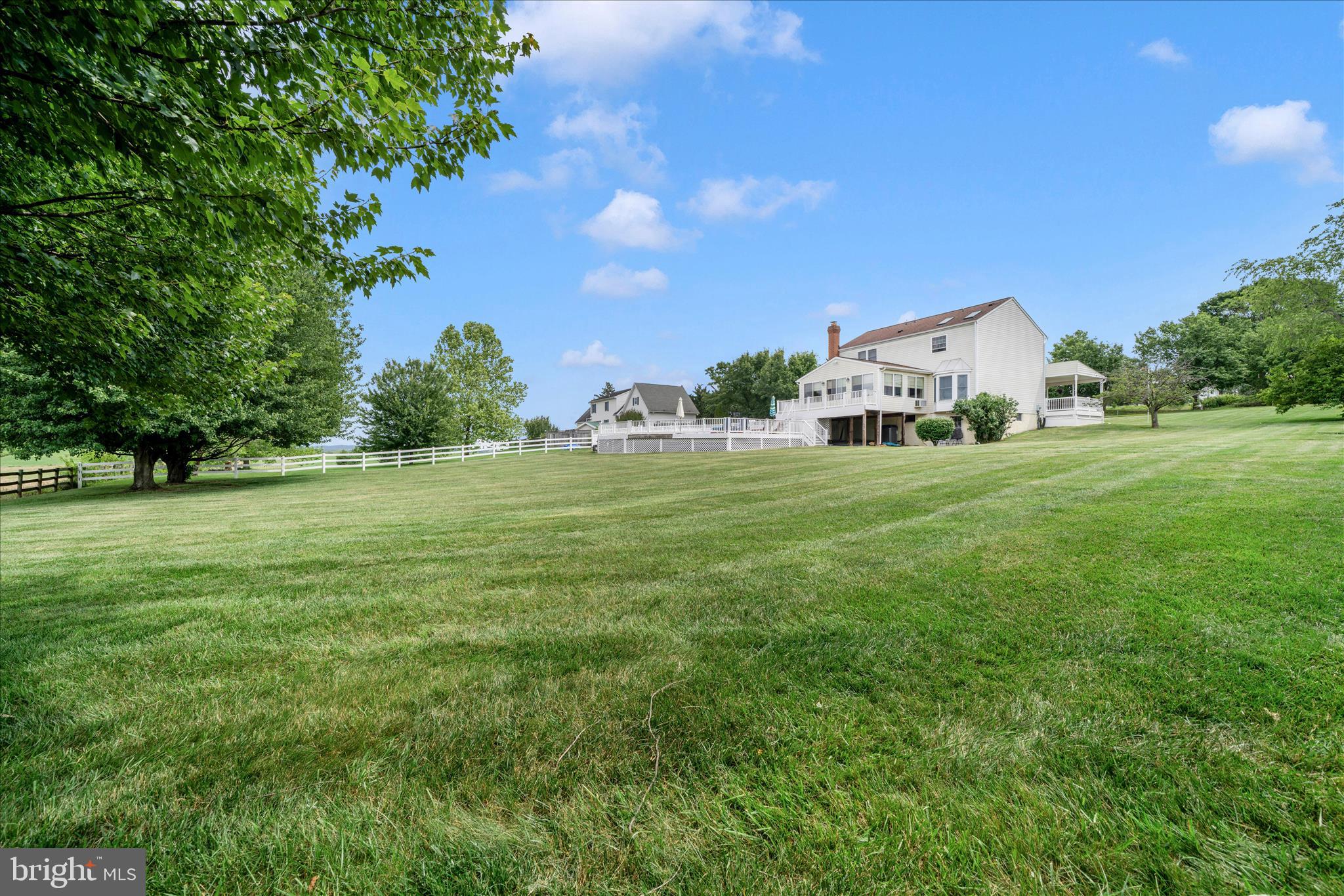 9534 Liberty Road Frederick, MD 21701 - Photo 56 of 70 a front view of a house with a yard and trees