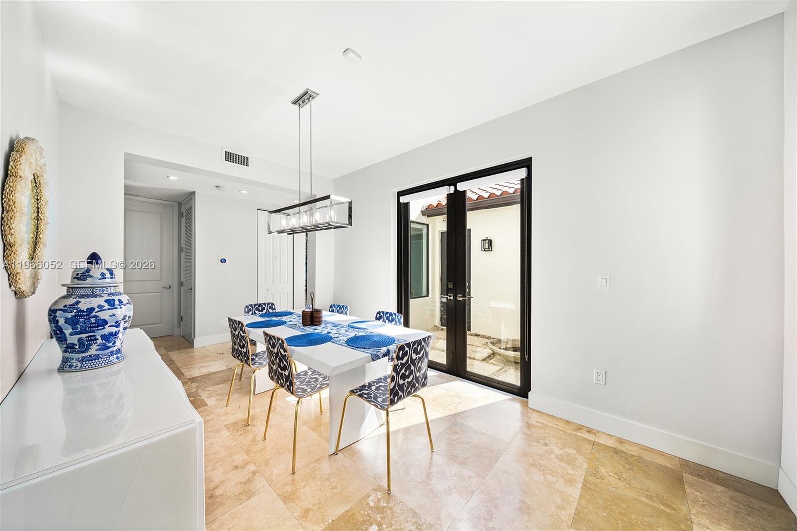 6001 Southwest 28th Street Miami, FL 33155 - Photo 8 of 30 a view of a dining room with furniture and a chandelier