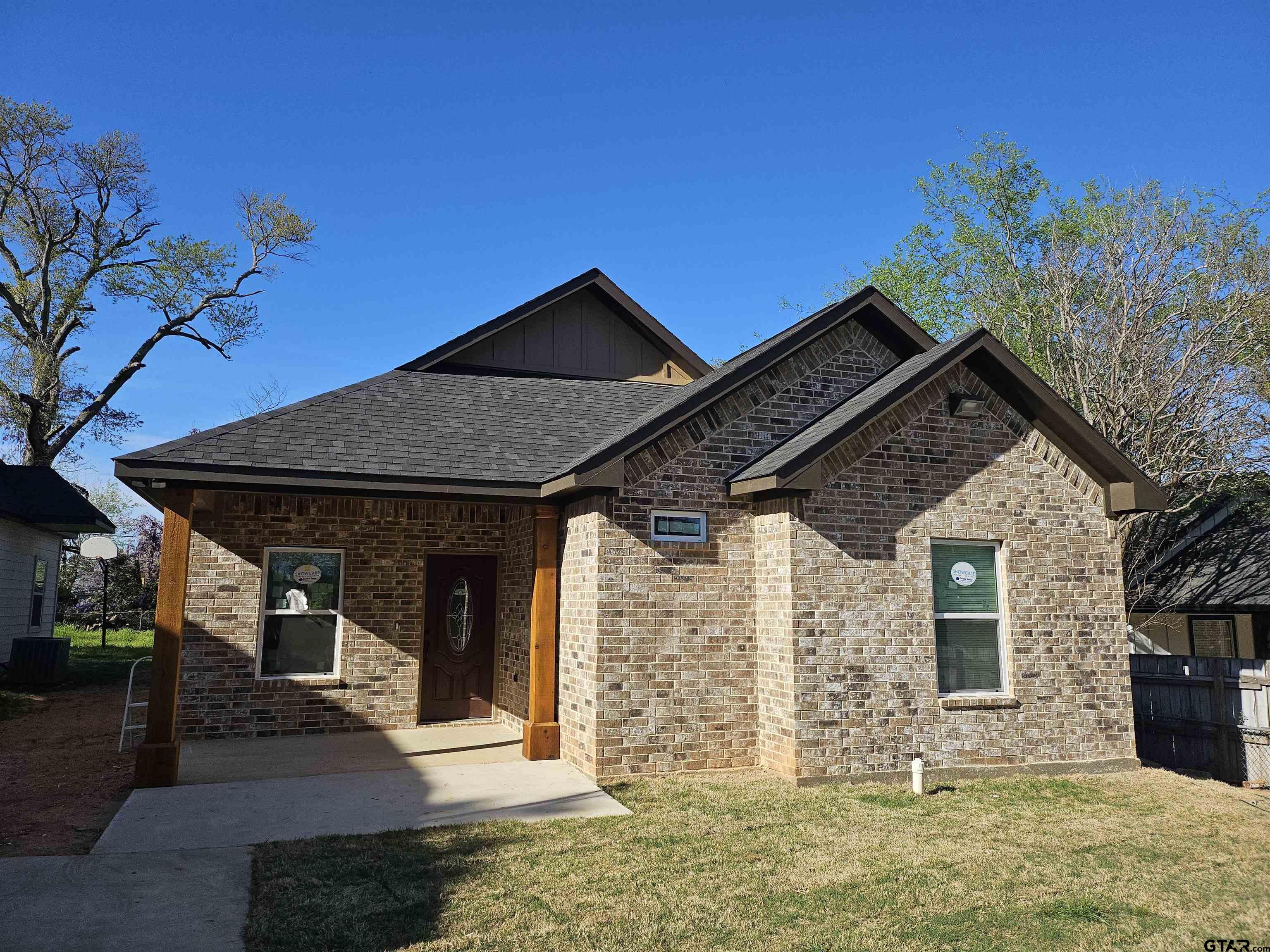 1399 West 2nd Tyler, TX 75701 - Photo 1 of 11 a front view of a house with garden