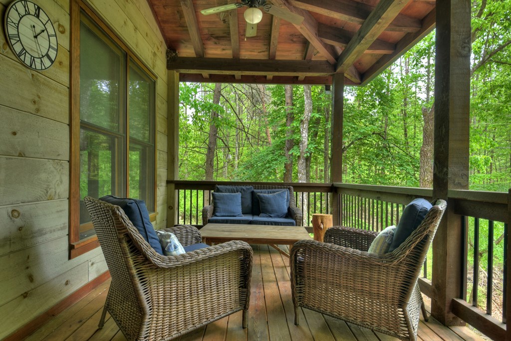 127 Jason Martin Circle Blue Ridge, GA 30513 - Photo 54 of 56 a view of a chair and table in the balcony