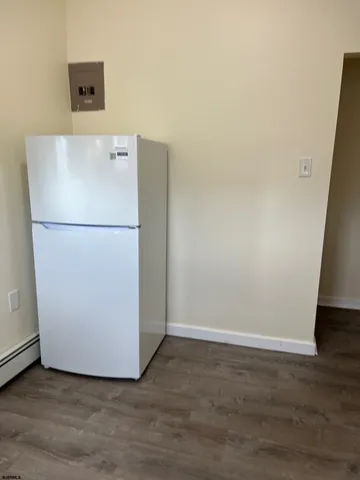 a white refrigerator freezer sitting in a kitchen